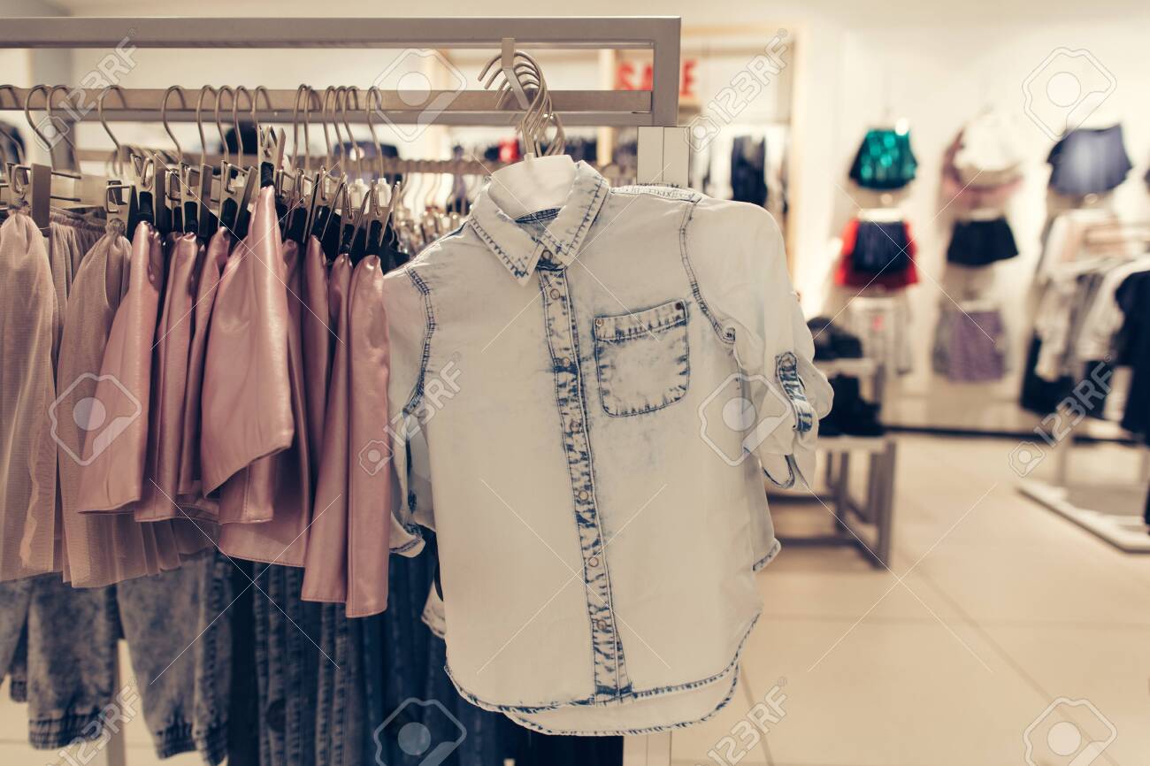 Clothing store. Shirt in clothes store. Denim shirt in shopping mall